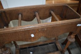 A late Victorian oak stick stand, labelled Goodalls, Manchester