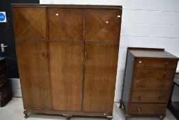 An early 20th Century two piece bedroom suite comprising wardobe and tallboy