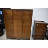 An early 20th Century two piece bedroom suite comprising wardobe and tallboy