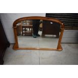 A modern pine overmantel mirror