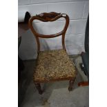 A Victorian mahogany balloon back chair having upholstered seat