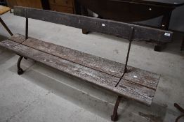 A vintage bench , reversible with cast frame, possibly station or steamer