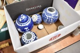 Four Chinese ginger jars having traditional blue and white designs including cracked ice and Peony.