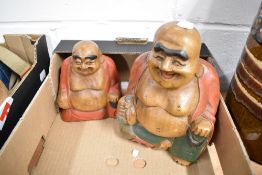 Two 20th century wooden carved Buddha figures by JIG.