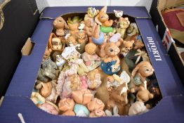 A selection of vintage figures and figurines including Moorcraft and Pendelfin