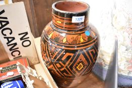 A Moroccan vase of Safi decoration with brown, yellow and black glaze
