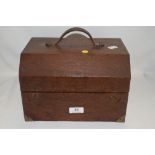 An antique doctors or vets case in mahogany with brass banding and folding top