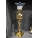 A fine Victorian oil lamp with brass base, ceramic shaft and vaseline glass shade 60cm tall with