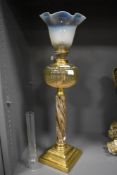 A fine Victorian oil lamp with brass base, ceramic shaft and vaseline glass shade 60cm tall with