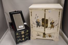 Two Japanese styled lacquer work cases including jewellery case and small cupboard with drawers