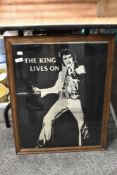 A framed mirror of Elvis Presley interest 'The King lives on'.
