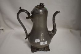 A James Dixon pewter tea of coffee pot with ivy leaf design handle spout and feet