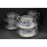 A set of modern Royal Tuscan breakfast tea cups and saucers with ploughing scene
