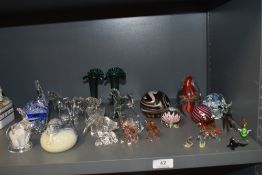 A selection of modern art glass wares including paper weights, figures and lamp work miniatures