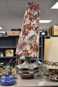 A large mid century floor lamp having bamboo pattern to shade.