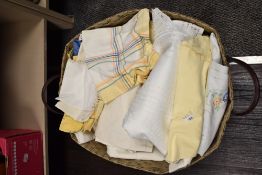 A hamper of vintage and retro table linen.