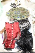 A mixed lot of vintage and antique to include millenary feathers, a peacock feather fan, velvet