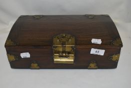 A modern oriental small wooden chest with brass banding and puzzle lock (no key)