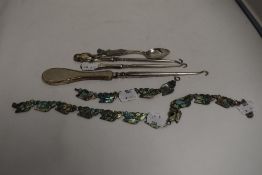 A selection of curios including lady golf spoon, Hm silver handle button hooks and Mexican silver