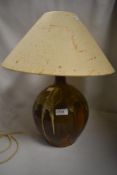 A mid century studio pottery lamp base with drip glaze, and naturalistic matching shade