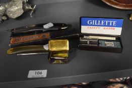 A selection of vintage razors including Gillette, The Laurel and two cut throat razors