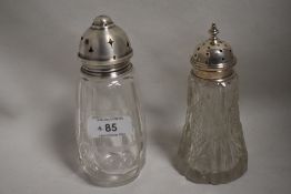 Two glass sugar casters having cut glass decoration and HM silver lids