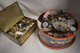 Two vintage tins with a large assortment of various buttons