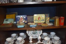 A selection of vintage advertising tins including Royal Coronation and penny saving money banks