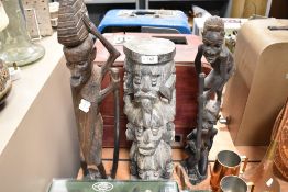 Three native African tribal wood carved figures including totem style stand and village eldar