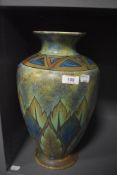 An Art Deco Chameleon ware vase with green and blue glaze having damage to foot