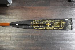 An interesting souvenir rowing boat oar hand painted for University college 1959