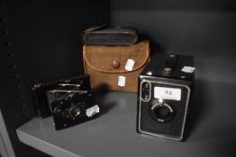 Two early Kodak cameras including Brownie no.2 and A-127