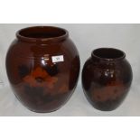 Two antique vase both having deep brown glaze with hand painted scenes of flowers