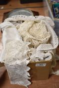 A box full of vintage and antique crotchet edging and similar.