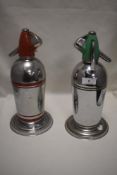 Two Art Deco era Sparklets cocktail soda syphons in red and green