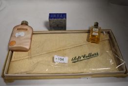 An unopened Bourjois wartime pack of Evening in Paris powder, a soft collar case and two vintage