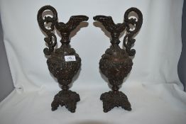 A pair of matching Victorian spelter Greek styled Ewers having a copper finish 33cm tall