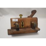 A Victorian beech wood moulding plane dated 1858 bearing makers name to brass plate and later names