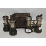 Two pairs of early 20th century binoculars both unmarked and one pair with case