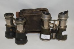 Two pairs of early 20th century binoculars both unmarked and one pair with case