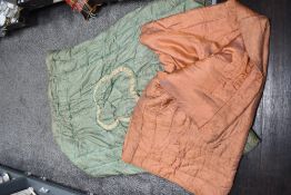 Two vintage cotton wool filled bed coverlets, one iridescent pink and the other green with champagne