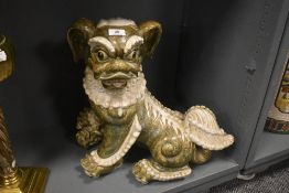 A modern Vietnamese ceramic figure of a temple dog of Fo in a naturalistic glaze 50cm long by 44cm