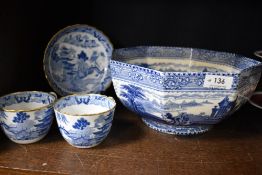 A selection of blue and white wares including two 18th century tea cups with saucer and an