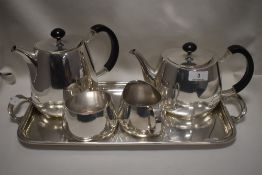 A 20th century Walker and Hall tea set and tray in a modernist design