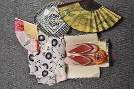 A collection of vintage oriental items including purse, shoes with box and fans.