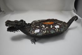 An ornate mythical dragon or turtle form lidded serving dish made in bronze with enamel decorated