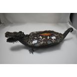 An ornate mythical dragon or turtle form lidded serving dish made in bronze with enamel decorated