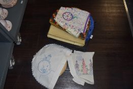 A lovely lot of six early 20th century tea cosies also a boxed tea cosy set, a Doyley case with