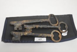 Three antique large cast iron door keys