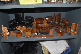 A selection of treen wood items including figures, containers and two pairs of elephant book ends
